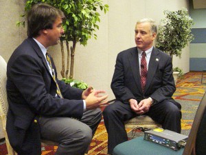 John Furrier intervieweing Howard Dean at TieCon in 2006.